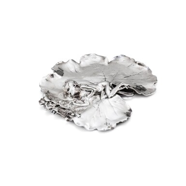 View full screen - View 1 of Lot 22. A silver water lily vide poche, Joseph Chéret for Eugène Soleau, Paris, dated 1894 | Vide poche en argent en forme de nénuphar par Joseph Chéret pour Eugène Soleau, Paris, daté 1894.