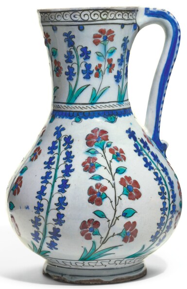 View full screen - View 1 of Lot 481. AN IZNIK POTTERY JUG WITH HYACINTHS AND CARNATIONS, TURKEY, 16TH CENTURY.