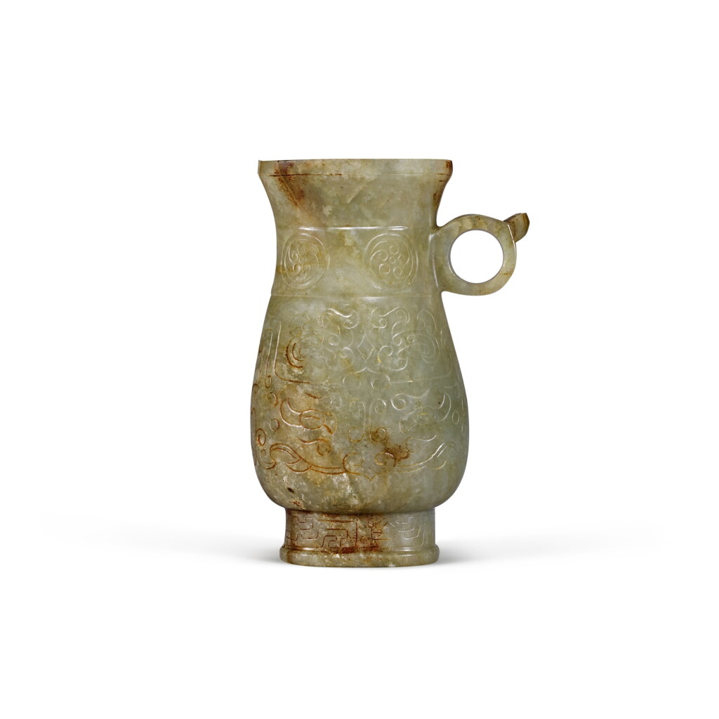 View full screen - View 1 of Lot 28. A mottled celadon jade baluster vase set with a single loop handle Ming dynasty | 明 青玉瓶.