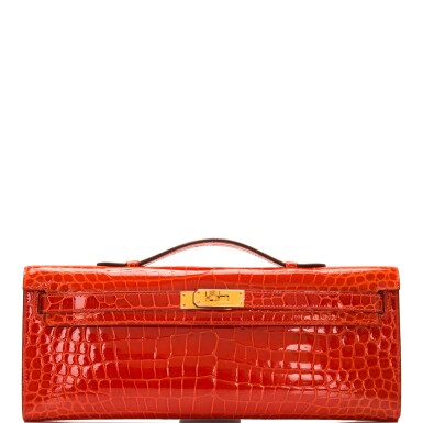 View full screen - View 1 of Lot 64. Hermès Orange Poppy Kelly Cut of Porosus Crocodile with Gold Hardware.