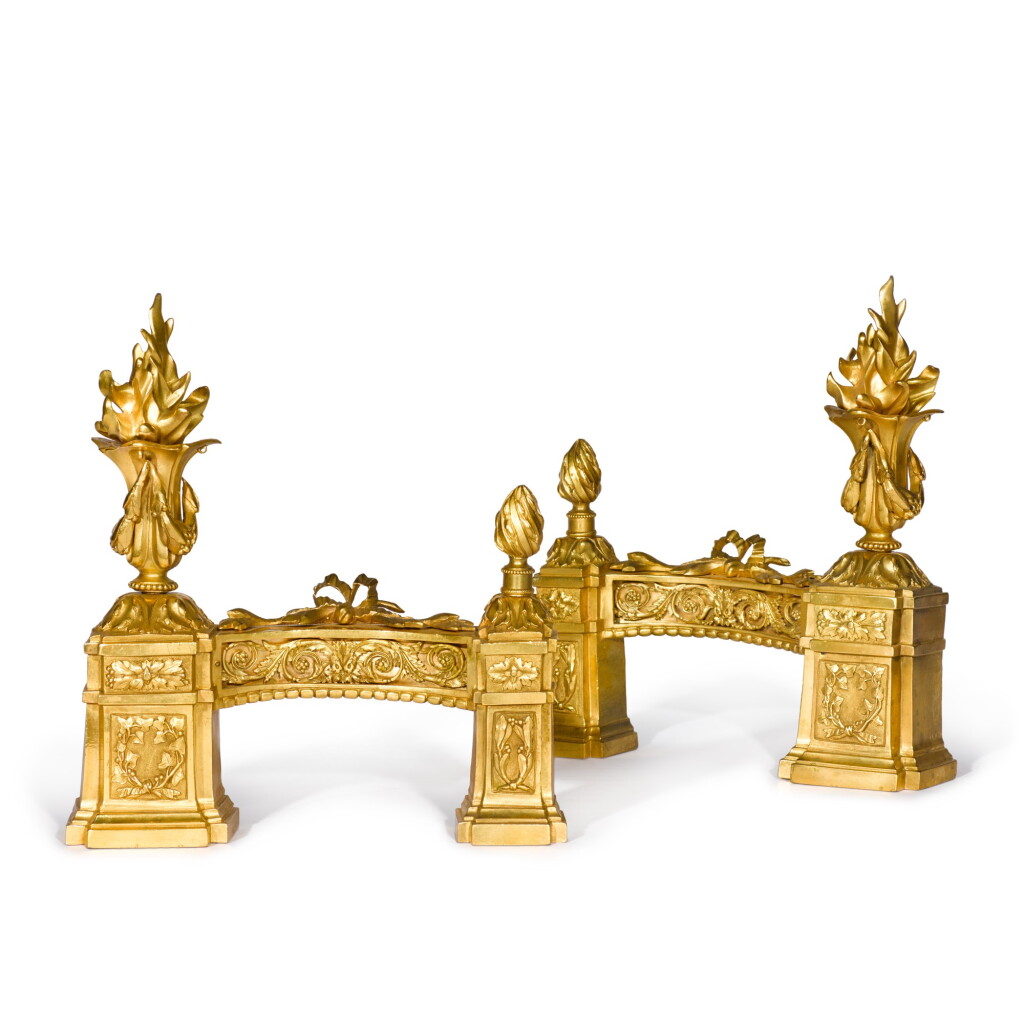 View full screen - View 1 of Lot 54. A pair of Louis XVI style gilt-bronze chenets, 19th century.