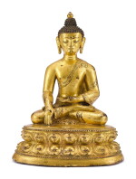 A GILT-BRONZE FIGURE OF SHAKYAMUNI BUDDHA, TIBET, 16TH CENTURY | 十六世紀 藏傳鎏金銅釋迦牟尼佛坐像