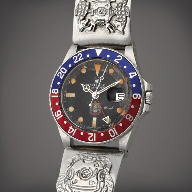 View full screen - View 1 of Lot 67. GMT-Master 'Desert Eagle', Reference 1675 A stainless steel dual time zone wristwatch with date and UAE Quraysh Hawk dial Circa 1979.