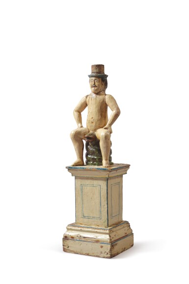 View full screen - View 1 of Lot 63. FINE AND RARE CARVED AND POLYCHROME PAINT-DECORATED PINE VICTORIAN WHIMSY OF A MAN SEATED ON A COILED GREEN SNAKE, LATE 19TH CENTURY OR EARLY 20TH CENTURY.