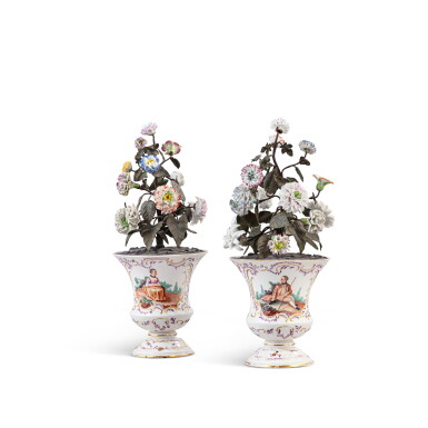 View full screen - View 1 of Lot 704. A pair of Frankenthal porcelain vases mounted with tôle-peinte stems and porcelain flowers, the vases circa 1772-73, the porcelain flowers 18th century and later.