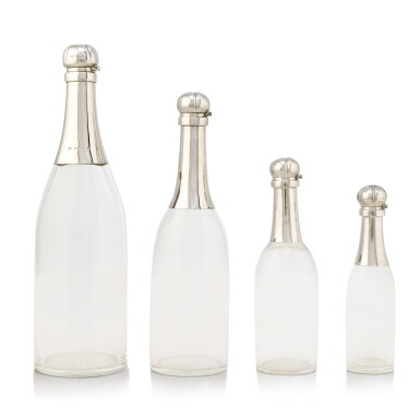 View full screen - View 1 of Lot 115. A group of Victorian silver champagne decanters, the largest Hukin & Heath, Birmingham, 1893; the smaller three John Grinsell & Sons, London, 1894/95.