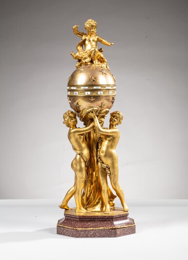 View full screen - View 1 of Lot 201. A Restauration gilt-bronze and Egyptian red porphyry pendule à cercles tournants aux Trois Grâces, circa 1830, after a model by François Vion | Pendule à cercles tournants aux Trois Grâces en bronze doré et porphyre rouge d'Egypte d'époque Restauration, vers 1830, d'après un modèle de François Vion.