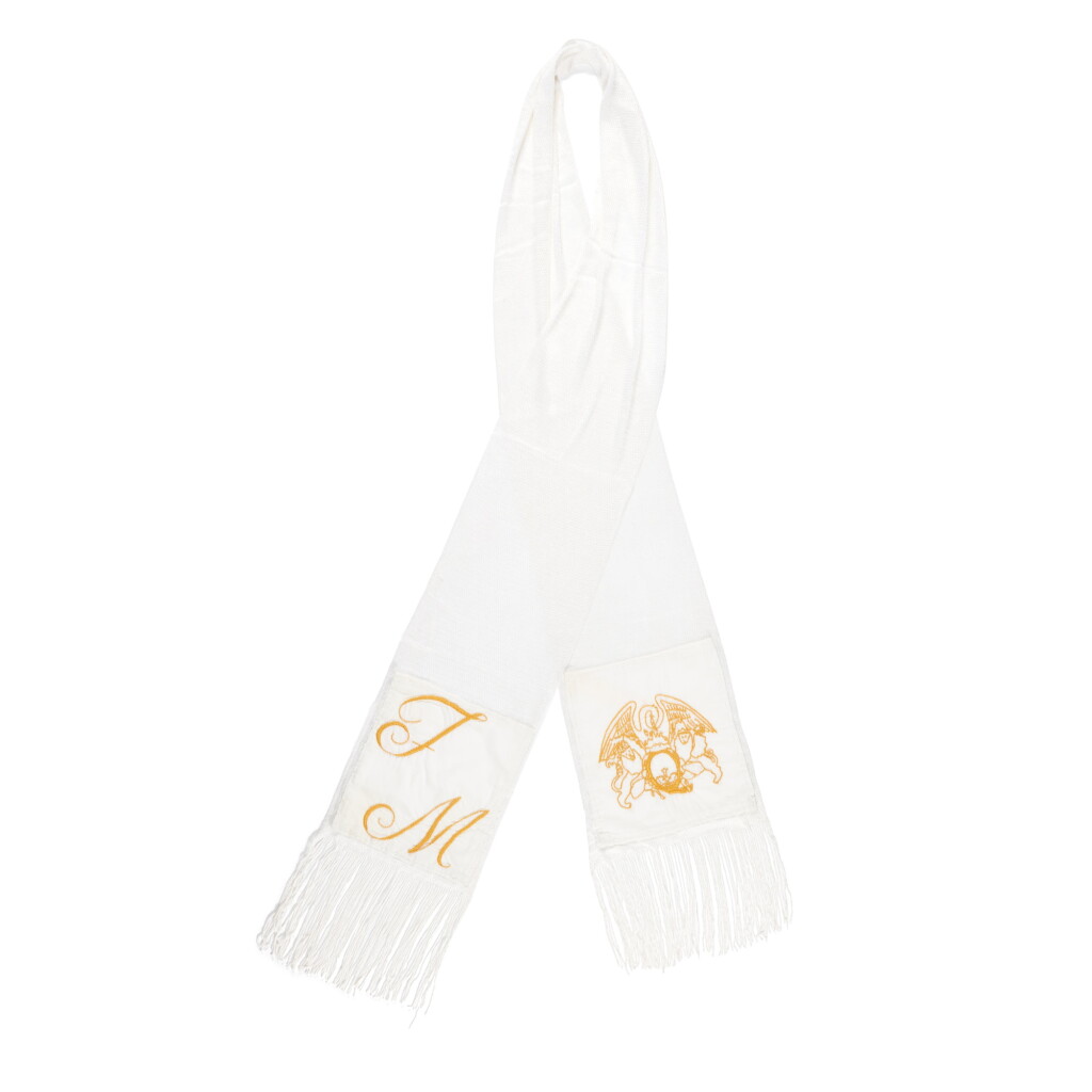View full screen - View 1 of Lot 274. Freddie Mercury's silk evening scarf monogrammed with his initials and the Queen crest.