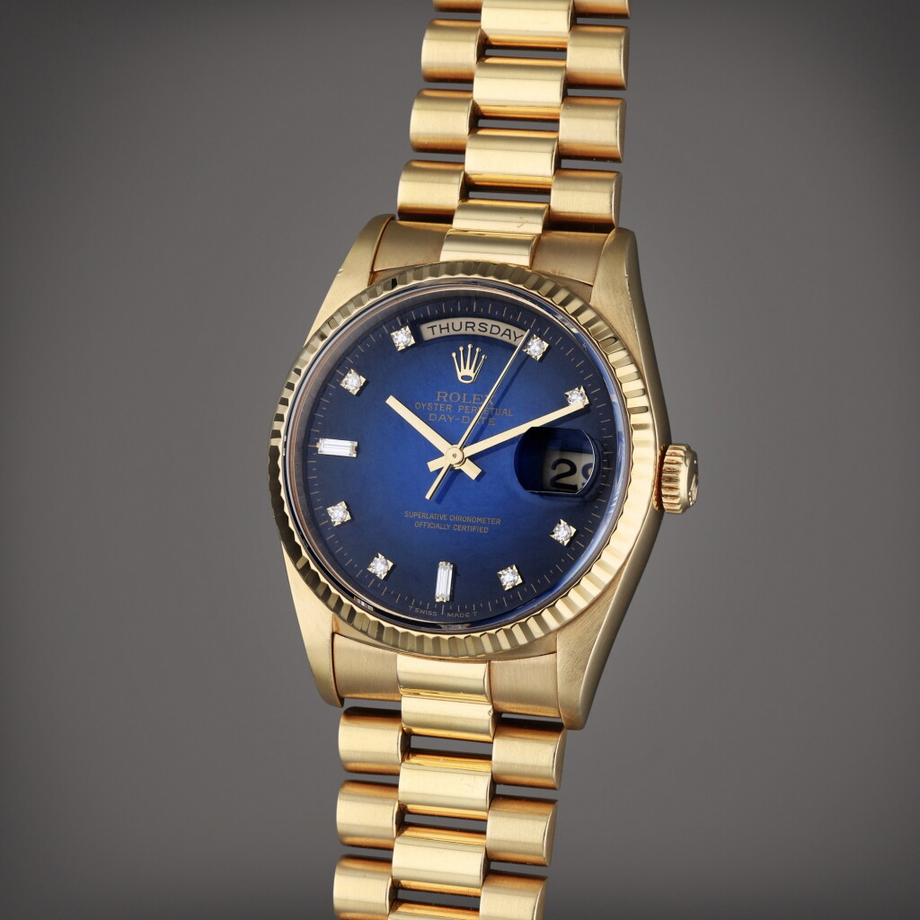 View full screen - View 1 of Lot 33. Reference 18238 Day-Date | A yellow gold and diamond-set wristwatch with day, date, blue dégradé dial and bracelet, Circa 1994.