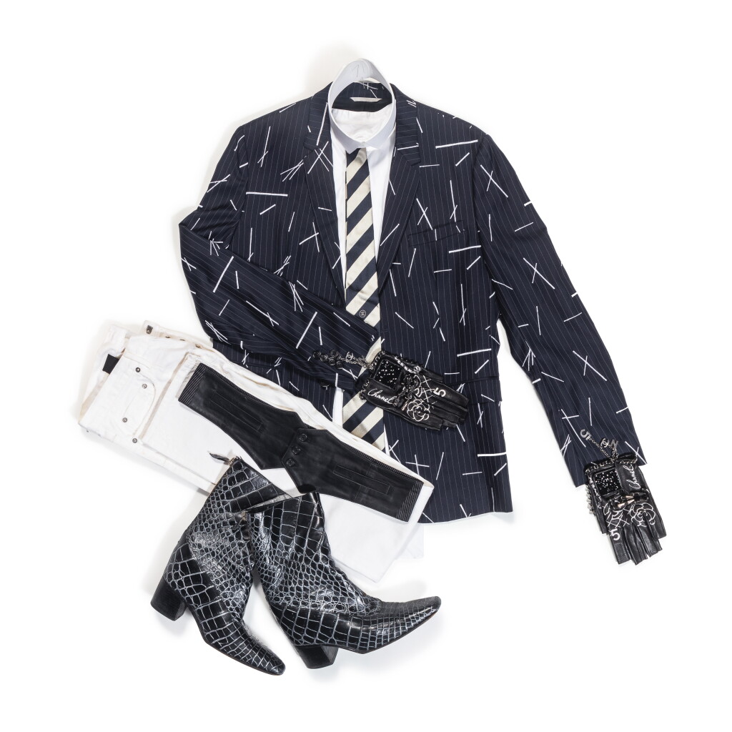 View full screen - View 1 of Lot 76. Karl Lagerfeld’s Total Look 7 "La Croisette" : Dior, Navy Blazer, Trench and Black Leather Belt; Hilditch & Key, White Shirt and Collar; Chanel, Striped Tie and Gloves & Massaro Crocodile Boots.