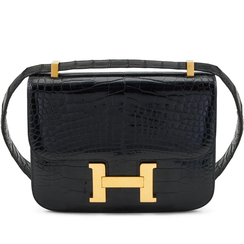 View full screen - View 1 of Lot 133. Vintage Black Shiny Mississippiensis Alligator Constance 23 Gold Hardware, 1990's.