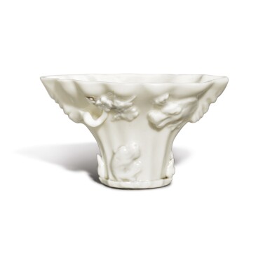 View full screen - View 1 of Lot 1033. A 'DEHUA' 'DRAGON AND LONGEVITY' MOLDED AND APPLIQUE LIBATION CUP, QING DYNASTY, 19TH CENTURY.