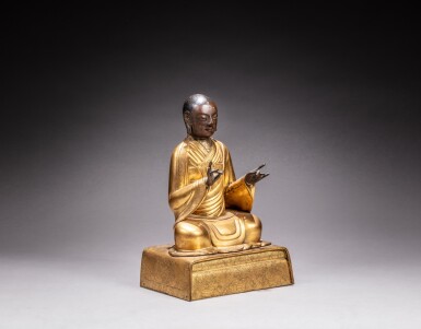 View full screen - View 1 of Lot 23. A gilt-copper repoussé and gilt-copper alloy figure of an Arhat, Qing dynasty, 18th century.