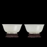 An exceptional and rare pair of white jade bowls, Qing dynasty, Qianlong period | 清乾隆 白玉光素撇口盌一對