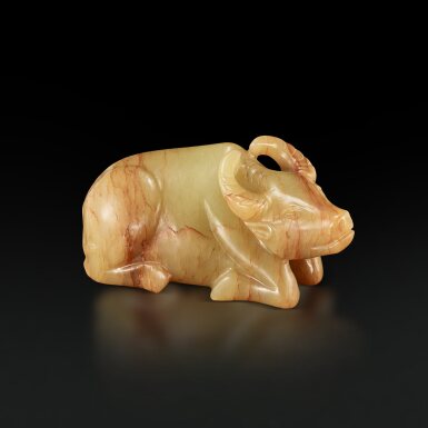 View full screen - View 1 of Lot 3679. A small yellow and russet jade figure of a recumbent buffalo, 17th century | 十七世紀 黄玉臥牛.