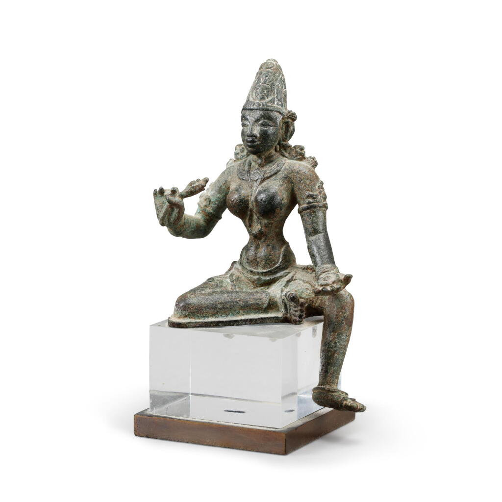 View full screen - View 1 of Lot 184. A bronze figure of a seated divinity, Probably Sri Lanka, Polonnaruwa period, ca. 11th century| 或為斯里蘭卡 波隆納魯瓦時期 十一世紀 铜神明坐像.