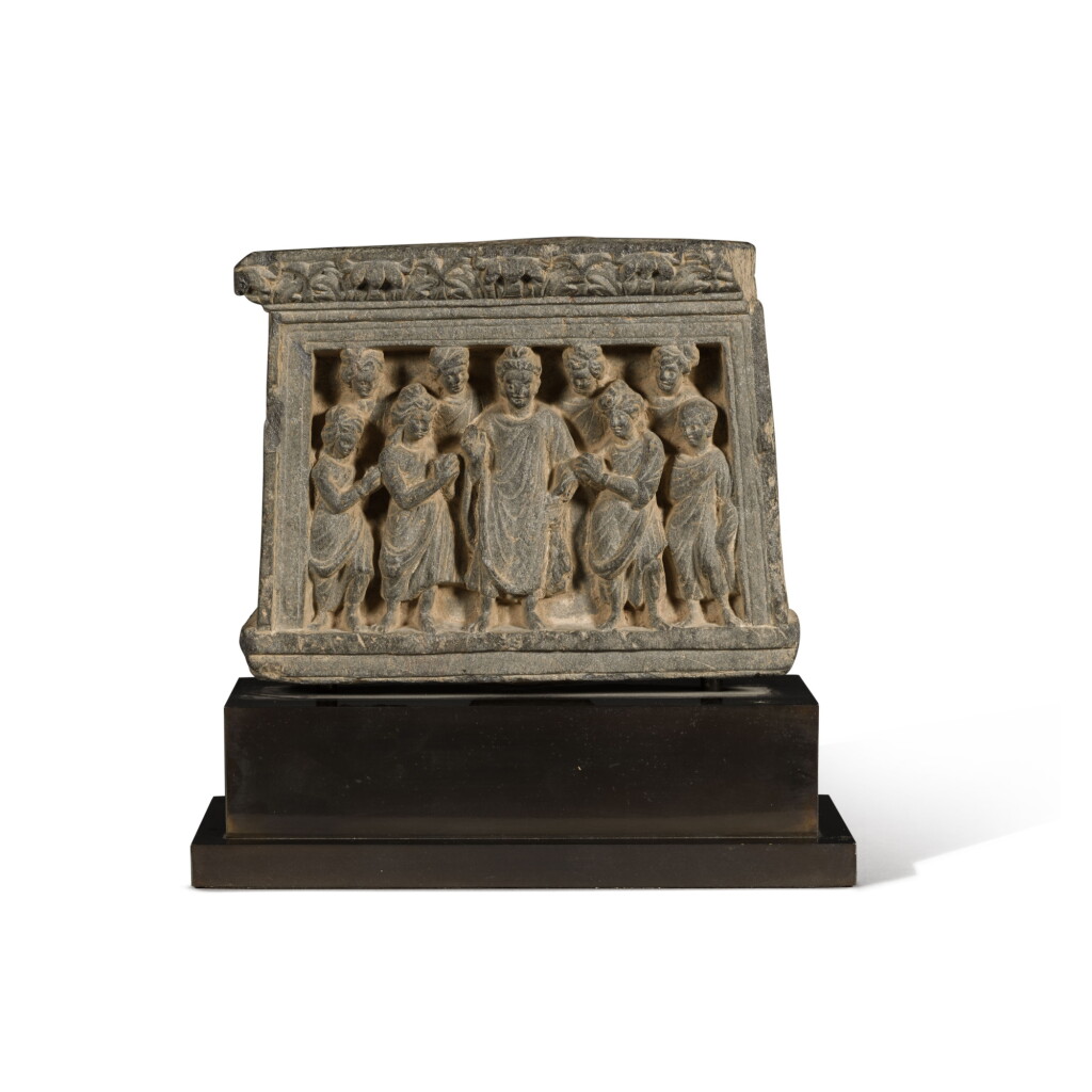 View full screen - View 1 of Lot 117. A grey schist frieze depicting Dipankara Buddha with attendants, Ancient Region of Gandhara, circa 3rd century .