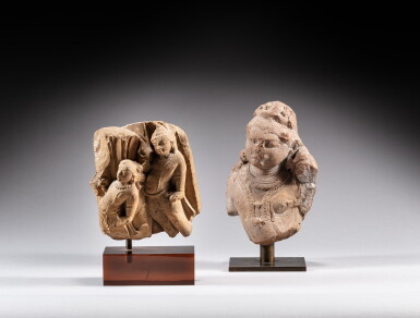 View full screen - View 1 of Lot 119. A sandstone fragmentary group depicting two Apsara and a sandstone bust of a deity, India, 11th-12th century | 印度 十一至十二世紀 砂岩石雕飛天殘石及砂岩石雕神胴體殘件一組兩件.