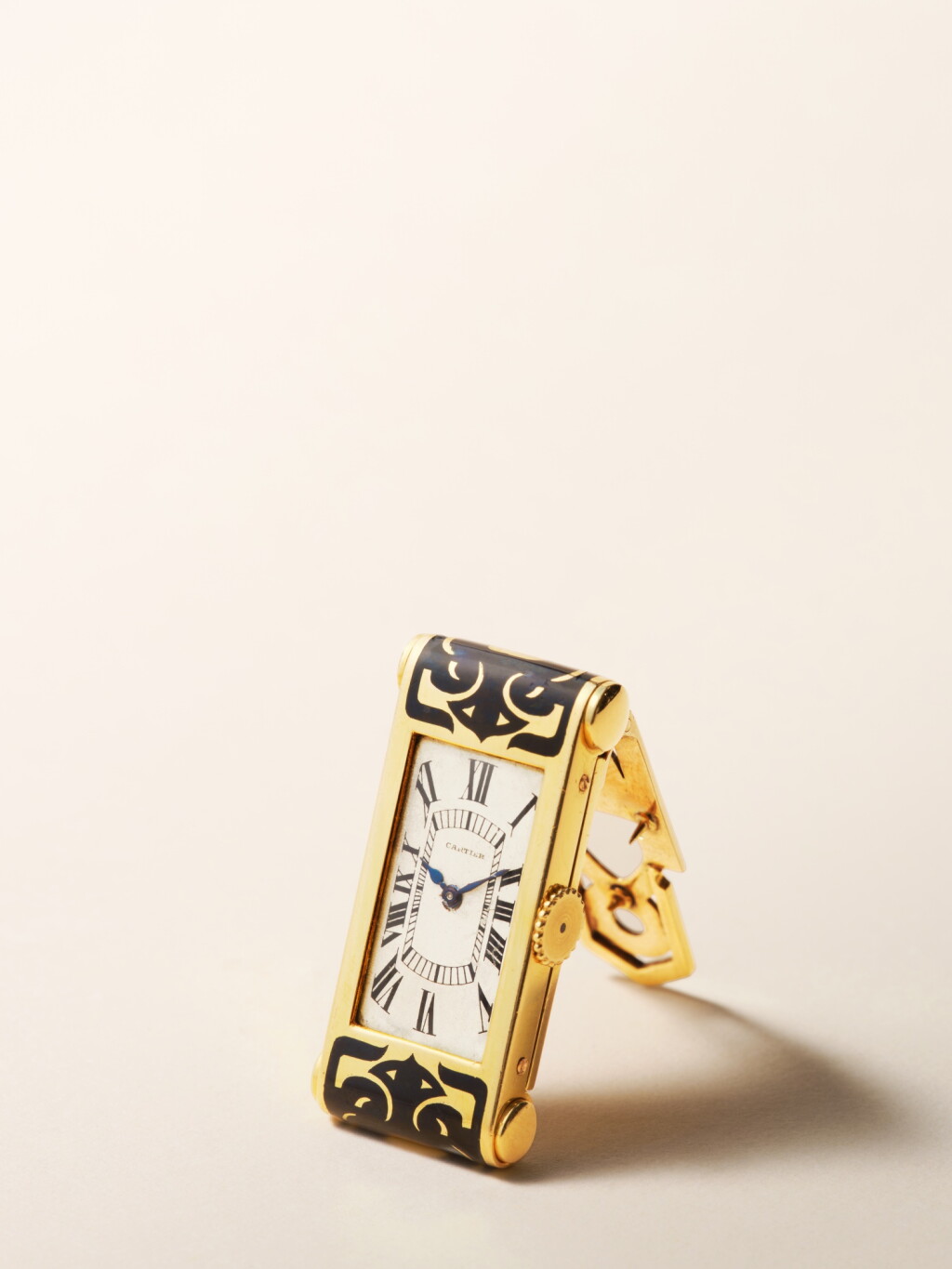 View full screen - View 1 of Lot 2150. London retailed | A yellow gold and black enamel Art Deco clip watch, Circa 1928-29 .