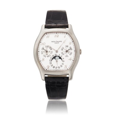 View full screen - View 1 of Lot 135. Reference 5040 | A white gold tonneau shaped automatic perpetual calendar wristwatch with moon phases, 24-hours and leap year indication, Circa 1995 | 百達翡麗 5040 | 型號白金自動上鏈萬年曆腕錶備月相、24小時及閏年顯示,約1995年製 .
