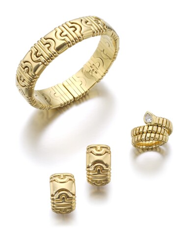 View full screen - View 1 of Lot 25. YELLOW GOLD BRACELET AND A PAIR OF EARRINGS, 'PARENTESI', AND A RING, 'SERPENTI' | BULGARI.
