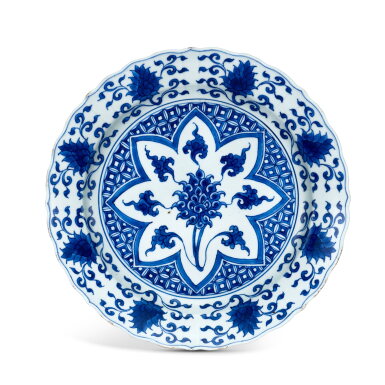 View full screen - View 1 of Lot 468. A blue and white 'lotus' foliate dish, Qing dynasty, Kangxi period 清康熙 青花錦地番蓮紋折沿菱口盤 《大明宣德年製》仿款.