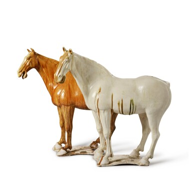 View full screen - View 1 of Lot 313. A pair of magnificent and rare large glazed pottery figures of horses, Tang dynasty | 唐 白釉及褐釉馬一對.