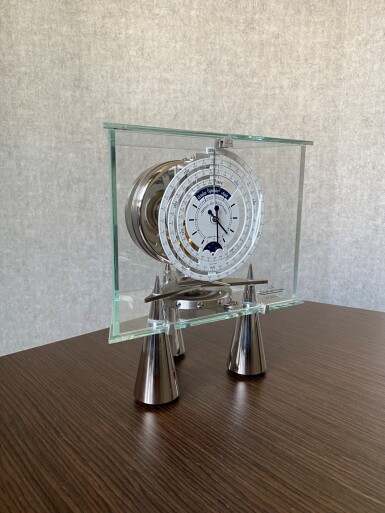 View full screen - View 1 of Lot 202. JAEGER-LECOULTRE | ATLANTIS, ATMOS DU MILLÉNAIRE STAINLESS STEEL AND GLASS ATMOS CLOCK WITH 1000 YEAR CALENDAR AND MOON PHASES CIRCA 2002.