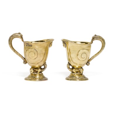 View full screen - View 1 of Lot 31. Two Victorian silver-gilt cream jugs, R. & S. Garrard & Co., London, 1874 and 1876.
