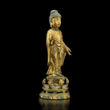View full screen - View 1 of Lot 119. A gilt-bronze figure of Buddha, Korea, Unified Silla dynasty, circa 8th century | 朝鮮 統一新羅時代 約八世紀 銅鎏金佛立像.