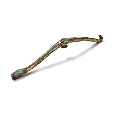 View full screen - View 1 of Lot 46. A gilt, silvered and turquoise-inlaid bronze belt hook, Warring States period | 戰國 銅鎏金銀嵌綠松石帶鉤.