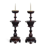 A pair of zitan archaistic 'kui dragon' candle sticks, Qing dynasty | 清 紫檀雕仿古夔龍紋燭臺一對