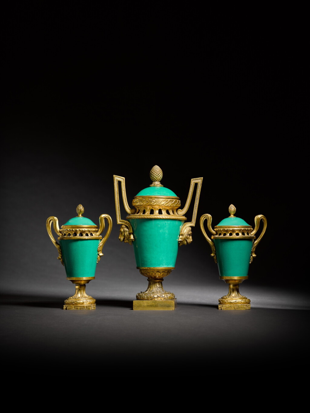 View full screen - View 1 of Lot 74. A late Louis XV gilt-bronze mounted three-piece garniture of Sèvres vases and covers ('vase à monter'), circa 1765-70.