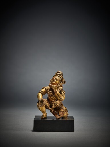 View full screen - View 1 of Lot 320. A Gilt Copper Figure Depicting a Demon Victim of Durga's Wrath, Nepal, circa 13th Century.