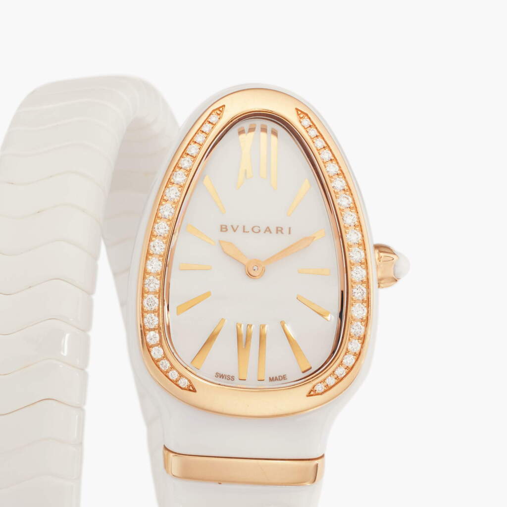View full screen - View 1 of Lot 92. Reference SP C 35 W G Serpenti Spiga | A white ceramic, pink gold, and diamond-set expandable bracelet watch, Circa 2020.