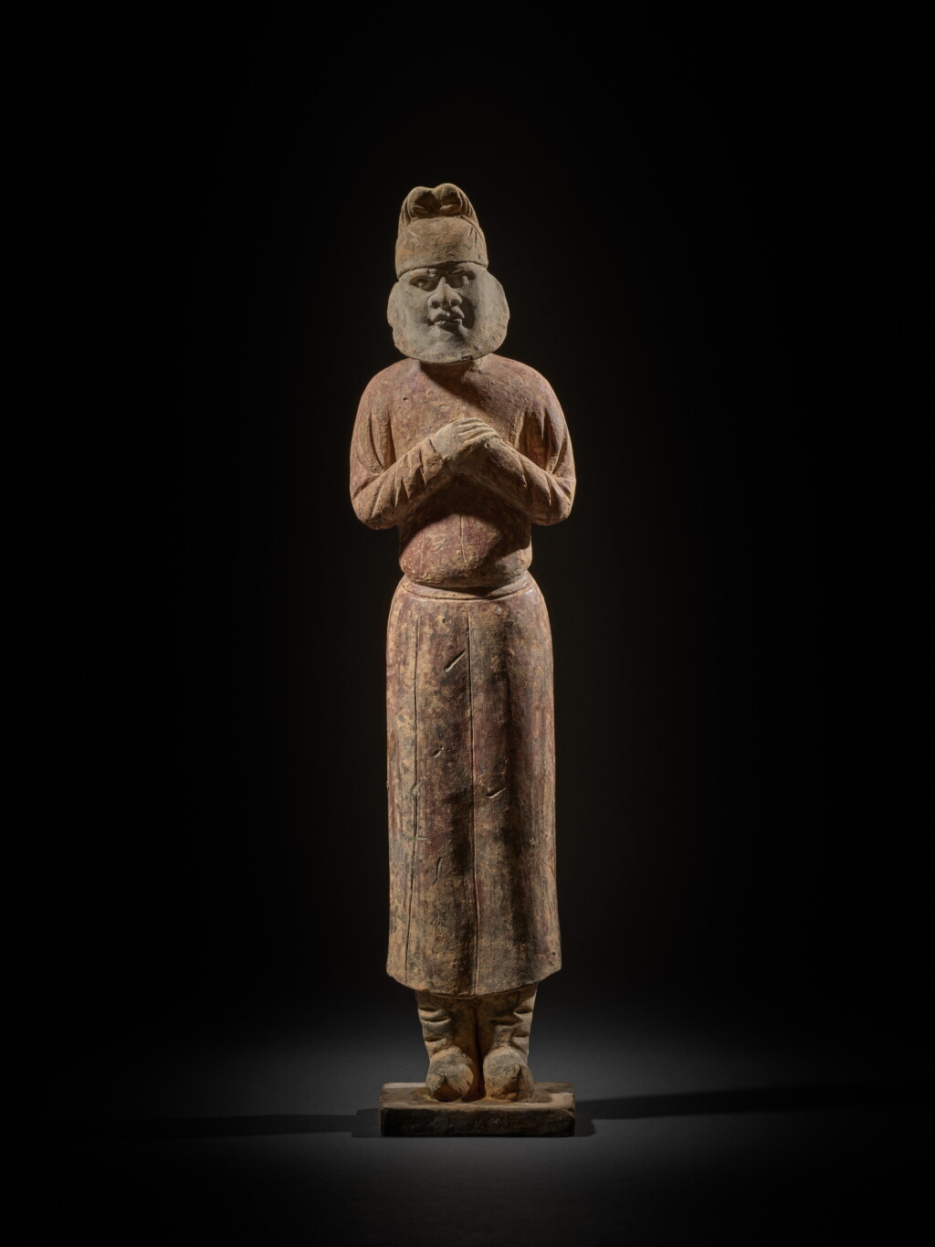 View full screen - View 1 of Lot 213. A painted gray pottery figure of a foreigner, Sui dynasty | 隋 灰陶加彩胡人立俑.