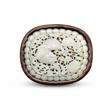 View full screen - View 1 of Lot 38. A reticulated white jade 'Buddhist lion' belt plaque, Late Ming dynasty .