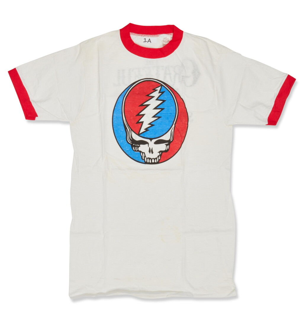View full screen - View 1 of Lot 41. Grateful Dead | Spring 1977 tour shirt, with an original backstage pass.