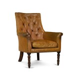A George IV leather upholstered bergère armchair, circa 1835