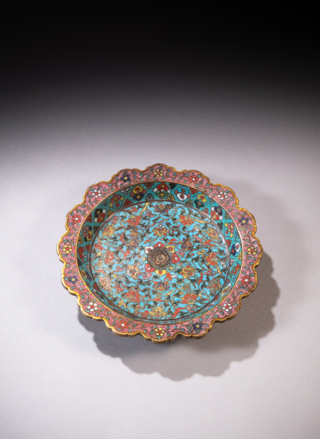 View full screen - View 1 of Lot 37. A cloisonné enamel 'floral' lobed tripod dish, Mark and period of Wanli | 明萬曆 掐絲琺瑯花卉紋花口盤《大明萬曆年製 》款 .