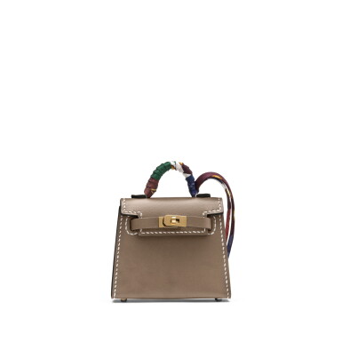 View full screen - View 1 of Lot 1021. Etoupe Tadelakt Micro Mini Twilly Kelly Bag Charm Gold Hardware, 2022.