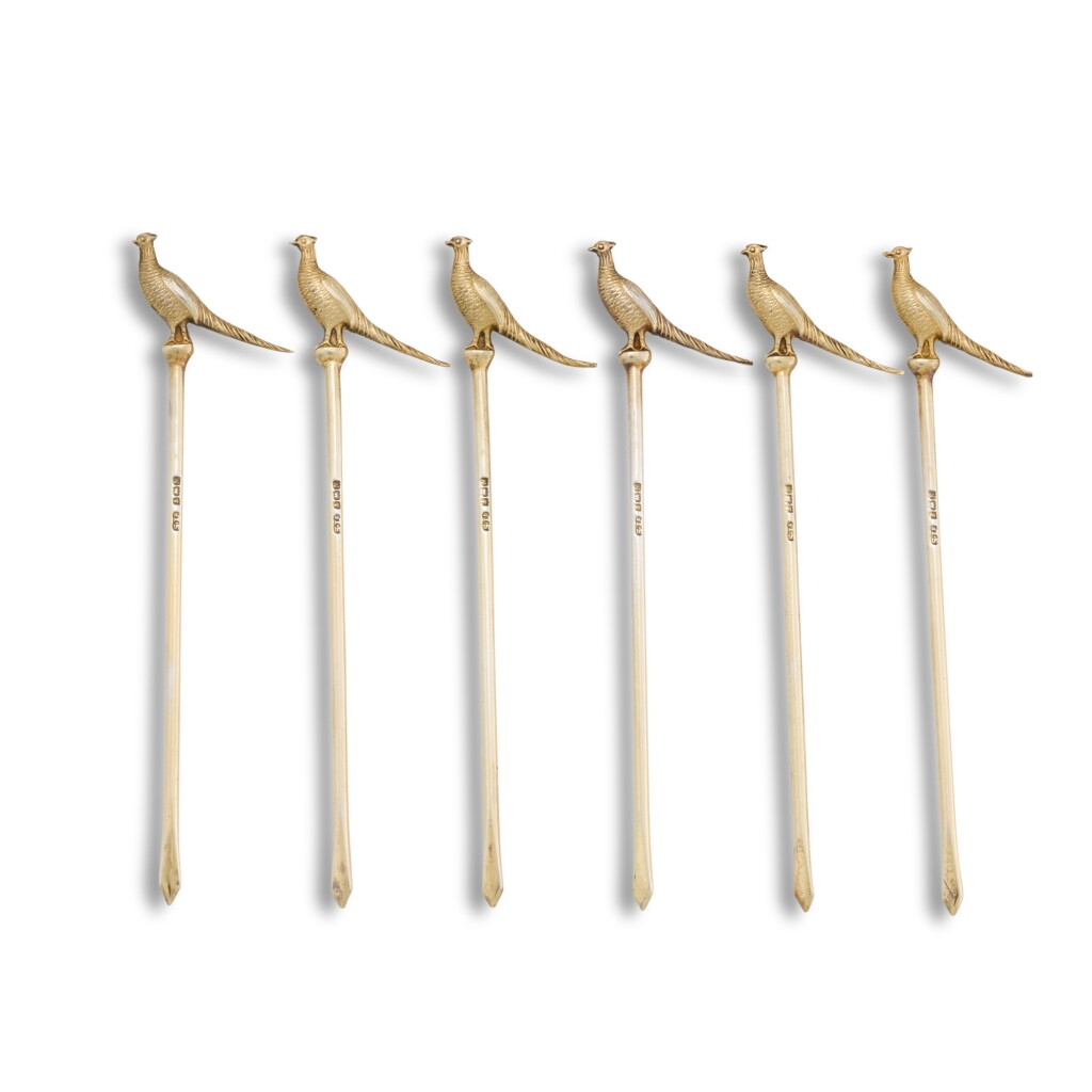 View full screen - View 1 of Lot 49. A cased set of six silver-gilt pheasant cocktail sticks, Suckling Ltd., Birmingham, 1937.