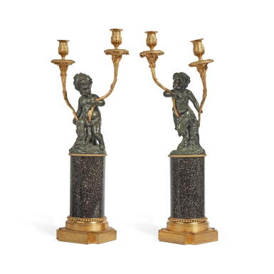 View full screen - View 1 of Lot 25. A Pair of Louis XVI Style Gilt and Patinated Bronze Two-Light Candelabra after Clodion, on Porphyry Bases.