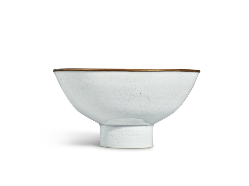 View full screen - View 1 of Lot 153. An exceptionally rare white-glazed 'Eight Buddhist Emblems' stem bowl, Mark and period of Xuande | 明宣德 白釉暗花纏枝蓮托八吉祥紋高足盌 《大明宣德年製》款.