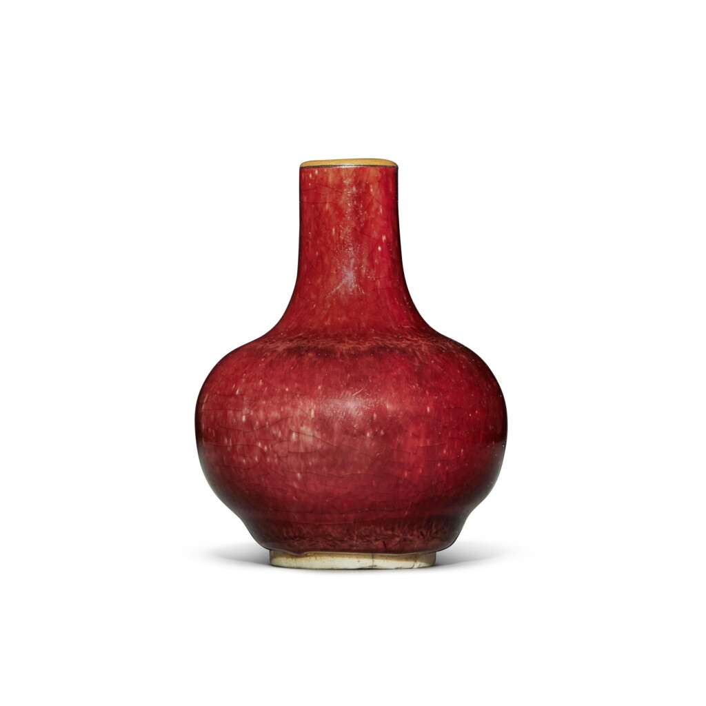View full screen - View 1 of Lot 161. A small red-glazed bottle vase, Qing dynasty, 17th / 18th century.