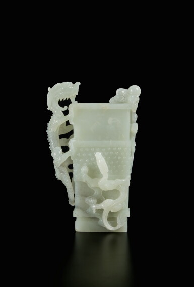 View full screen - View 1 of Lot 446. An archaistic white jade 'dragon' vase, Qing dynasty, 18th / 19th century | 清十八 / 十九世紀 白玉雕仿古龍紋瓶.