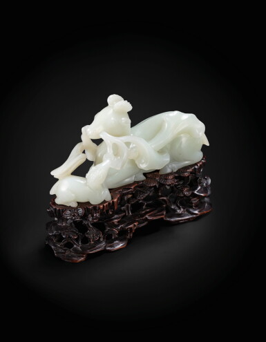 View full screen - View 1 of Lot 111. A very fine and rare Chinese jade carving of a recumbent deer and fawn, lu Late Ming dynasty-Qing dynasty |
明晚期至清 青白玉鹿銜靈芝擺件
.