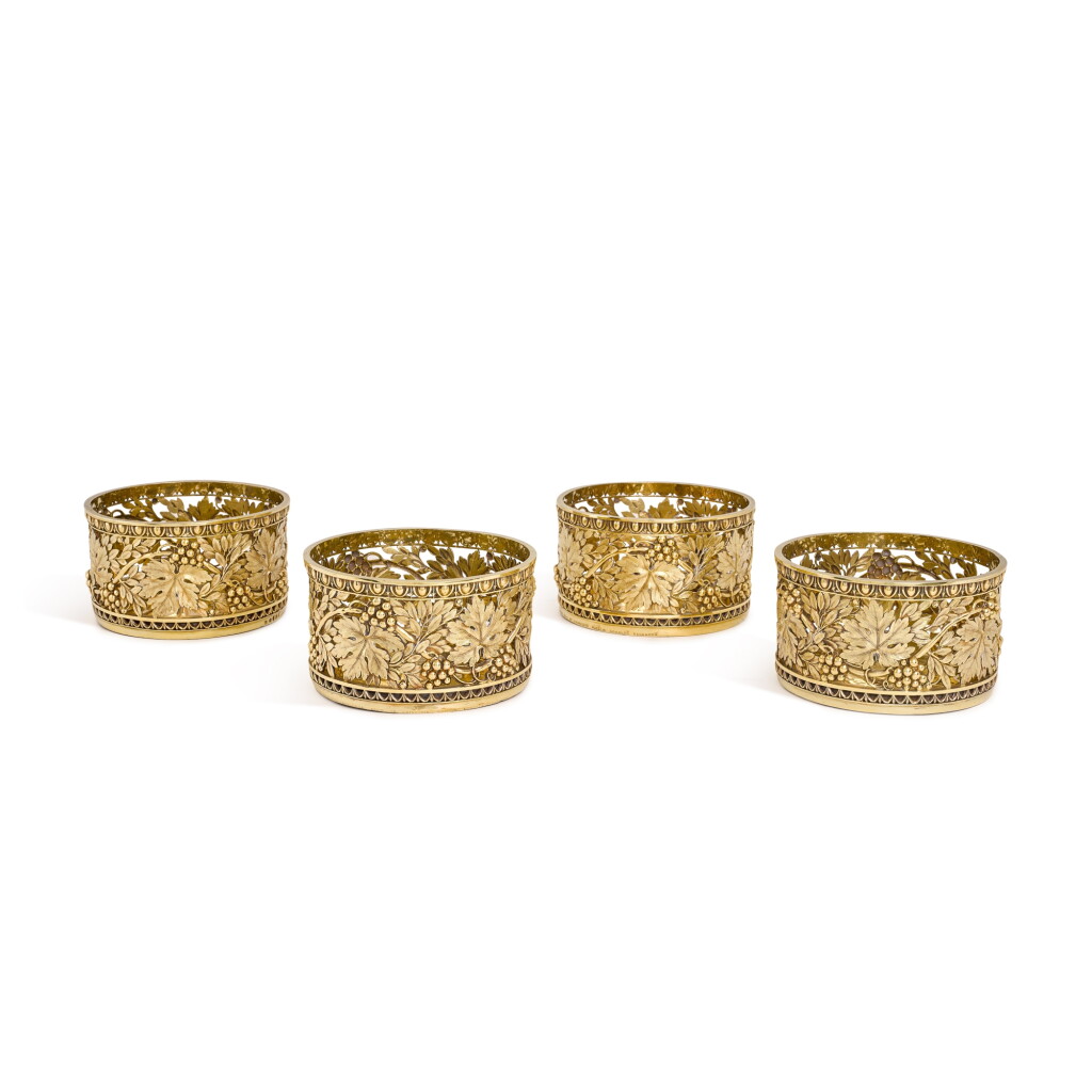 View full screen - View 1 of Lot 136. Royal: a set of four George III silver-gilt coasters, Digby Scott & Benjamin Smith, London, 1805/1806.