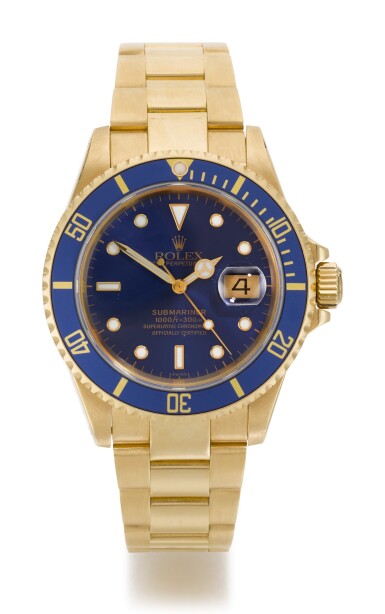 View full screen - View 1 of Lot 8. ROLEX | SUBMARINER, REFERENCE 16618, YELLOW GOLD WRISTWATCH WITH DATE AND BRACELET, CIRCA 1999.