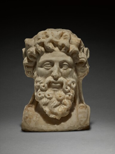 View full screen - View 1 of Lot 33. A Roman Marble Herm Head of Silenos, circa 1st Century A.D..